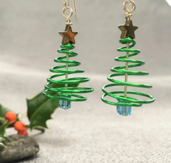 green wire spiral earrings with gold star