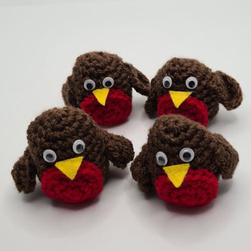 group of four crocheted robins