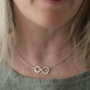 Hammered sterling silver infinity necklace pendant on 16in maxi belcher chain shown on model