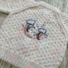 Baby cardigan to fit 0 - 6 months in speckled yarn with cute unicorn embroidery