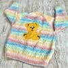 Girl's hand knitted cardigan to fit age 2 - 3 years with cute applique puppy