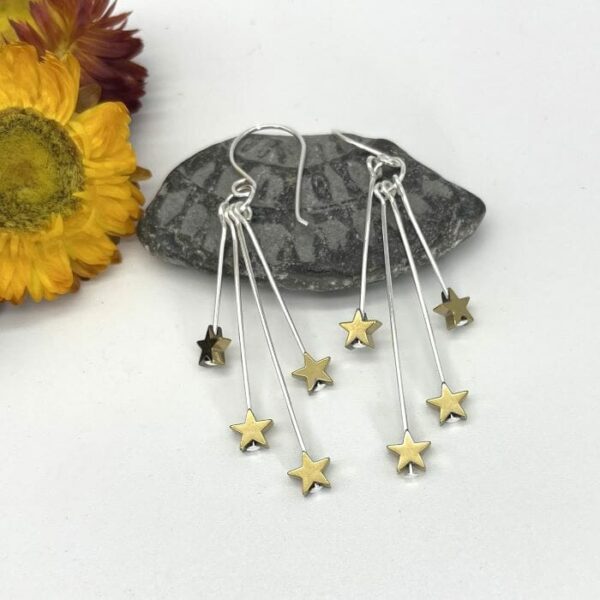 gold plated stars falling from silver drop earrings