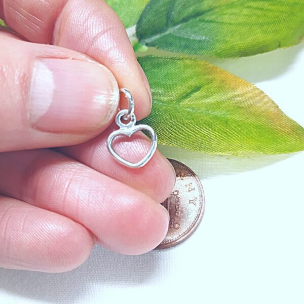 Sterling silver heart shaped charm.