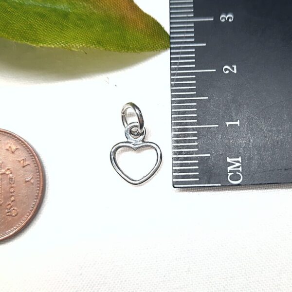 Sterling silver heart shaped charm.