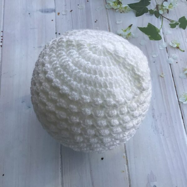 Crochet baby hat in white.