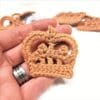 Crochet crown appliques in silver and gold yarn