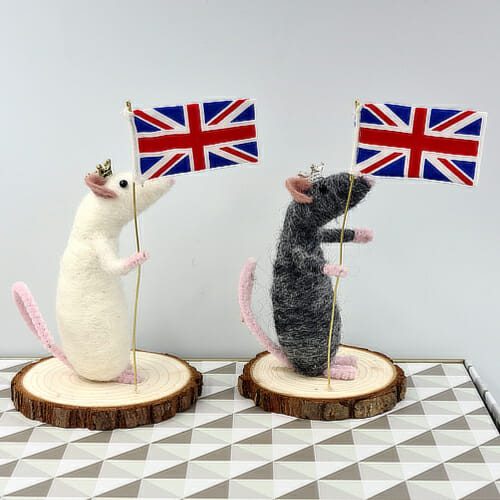 side view of Needle felted mice holding a union flag