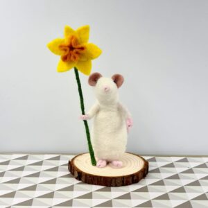 Needle felted white mouse holding a daffodil
