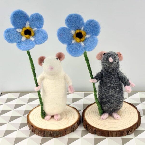 needle felted mice holding forget-me-not flowers