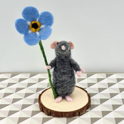 grey needle felted mouse with forget-me-not flower