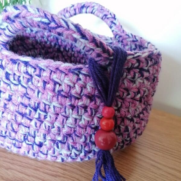 crocheted-basket-in-pinks-purples