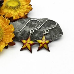 yellow and red patterned enamel on star shaped earrings on silver ear wires