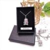 Beaded silver coronation crown necklace.