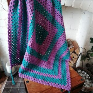 crocheted-pink-teak-lap-blanket