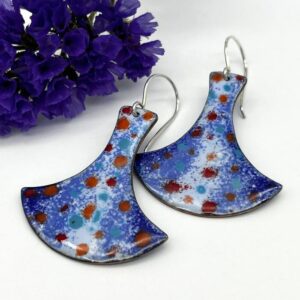 long thor hammer shape with enamel finish in blue patterns with highlights of red on silver ear wires