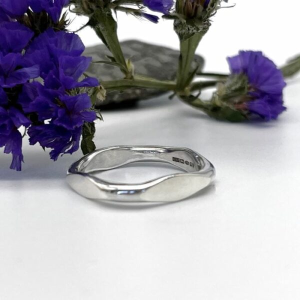 Chunky silver ring with forged square outer and round inner. Fully hallmarked