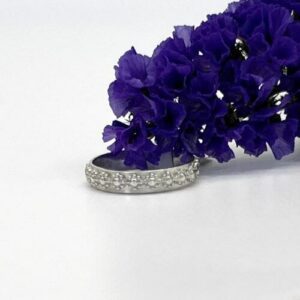 silver band ring with small daisy flowers around the center