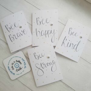 Positivity cards each with bee button and different message