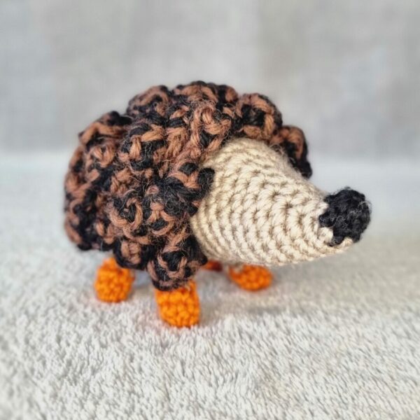 Hedgehog made of pure wool with orange toes