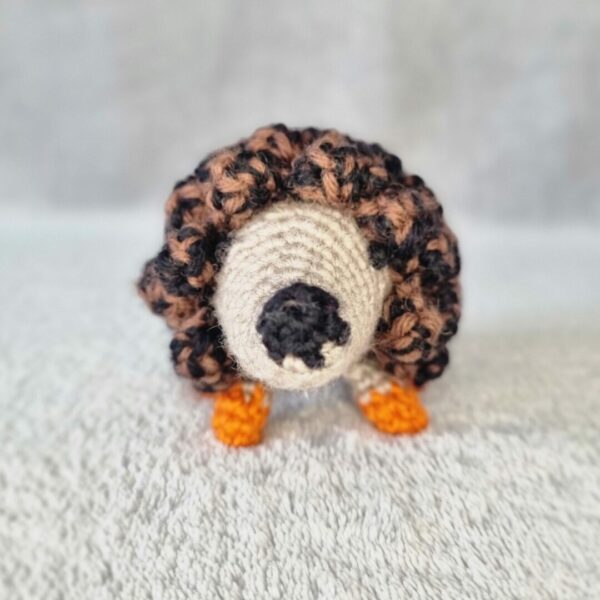 Crocheted hedgehog soft toy.