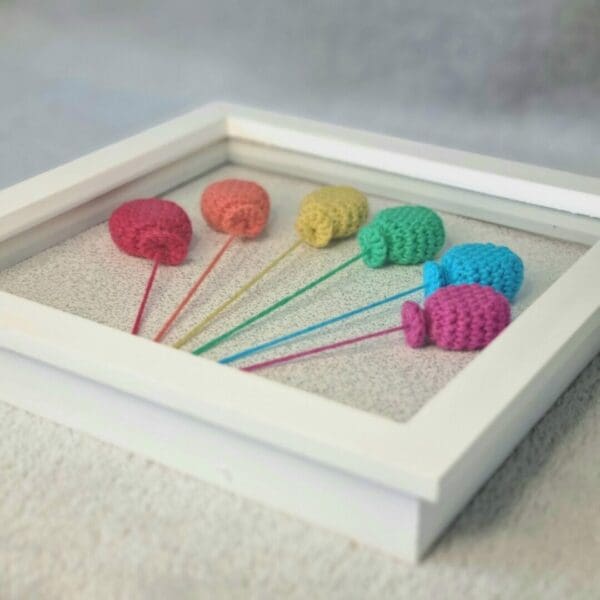 3D crochet rainbow balloons in box frame