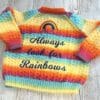 Girl's cardigan with decorative embroidered rainbow on back to fit age 3-4 years