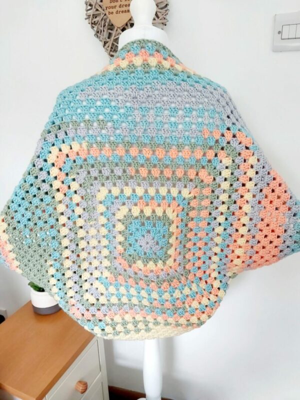 Pastel rainbow crochet granny square cardigan shrug.