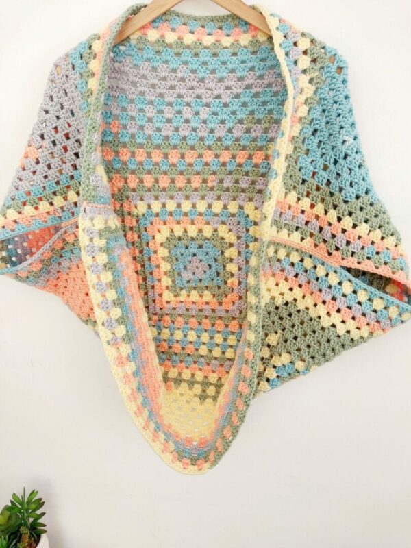 Crochet granny square cardigan shrug in pastel ombre yarn called sweet dreams.