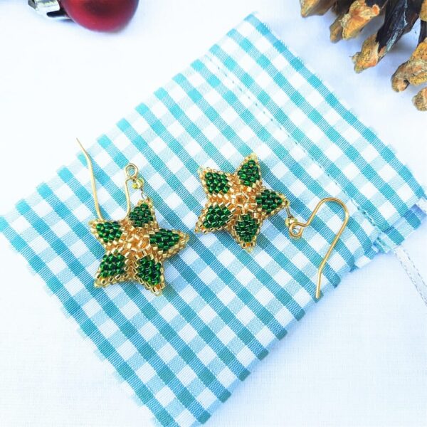 Christmas star earrings in green with gold.