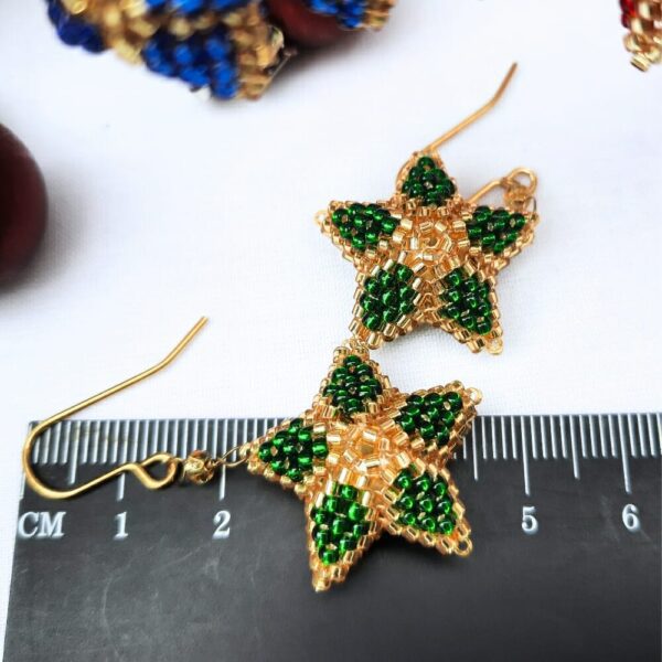 Christmas star earrings in green with gold.