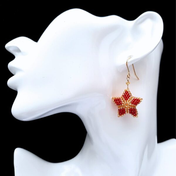 Christmas star earrings in red with gold.