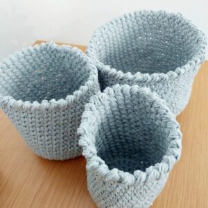 Set of 3 grey cotton nesting storage baskets.