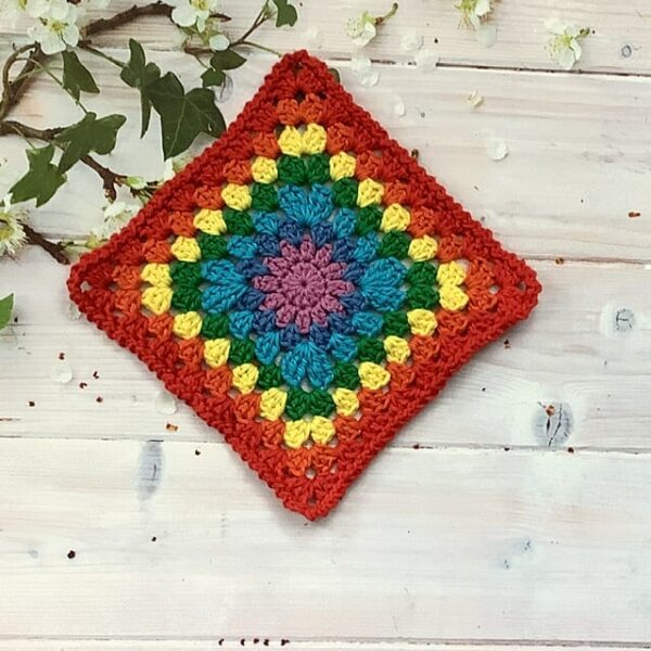 Crochet rainbow square table mat