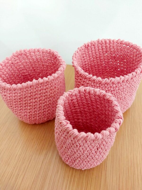 Set of 3 Pink cotton nesting storage baskets.