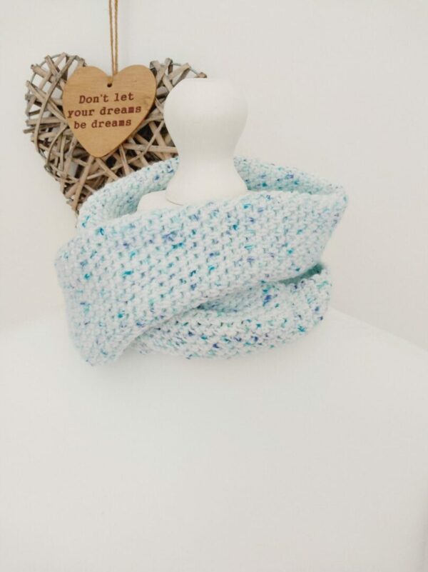 Crochet cowl scarf in soft white with blue flecks.