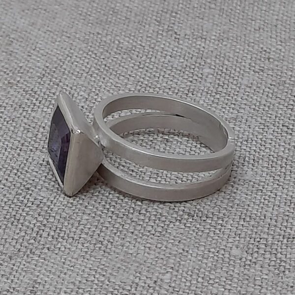 side view of amethyst and silver ring