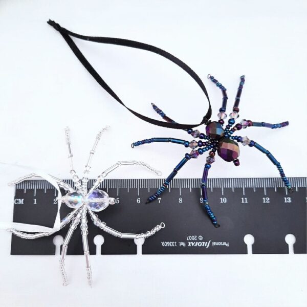 Halloween hanging spider decorations in silver and shimmery black beads.