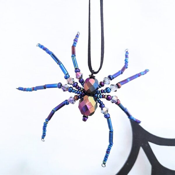 Halloween hanging spider decorations in shimmery black beads.
