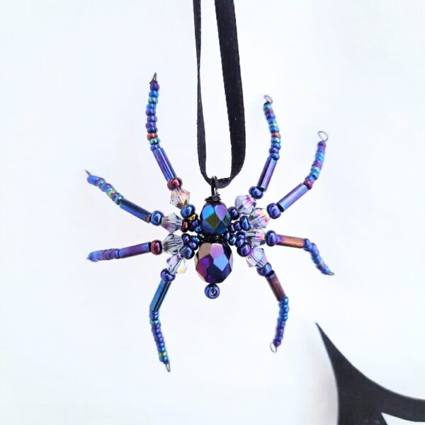 Halloween hanging spider decorations in shimmery black beads.