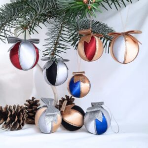 Silver and gold satin Christmas baubles with a glittery bow on top. Paired with colour variations of red, blue and black.