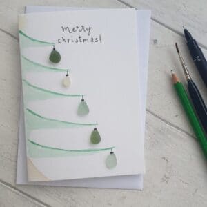 Watercolour Christmas cards with added seaglass as baubles and the message 'Merry Christmas'