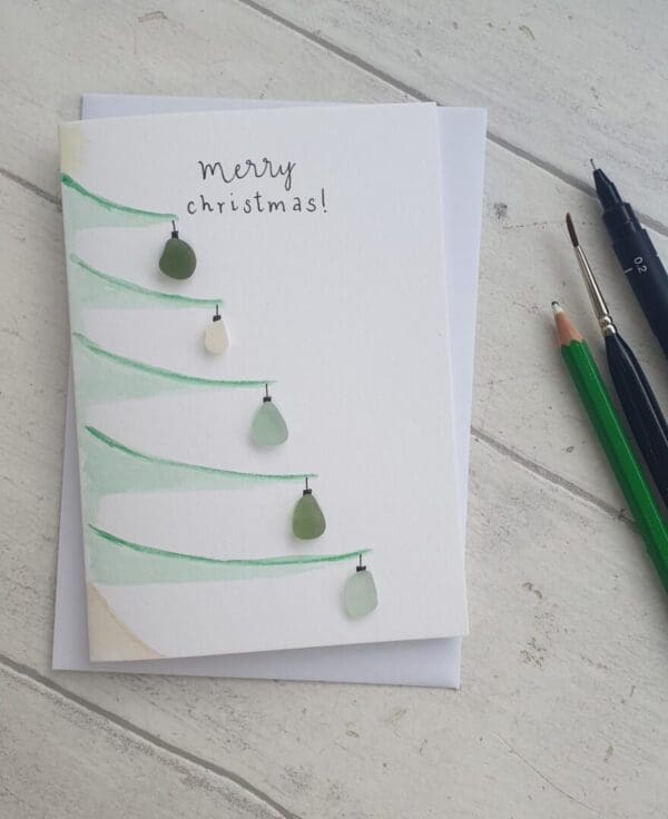 Watercolour Christmas cards with added seaglass as baubles and the message 'Merry Christmas'