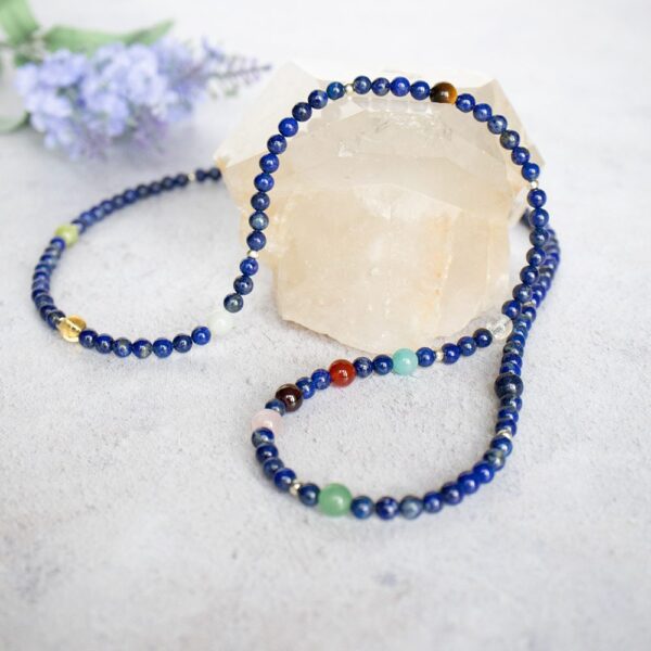 personalised astrology necklace in lapis lazuli on rock