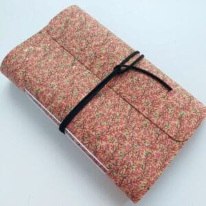 Pink blossom printed cork fabric notebook journal. with a black faux suede wrap tie.