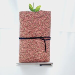 Pink blossom printed cork fabric notebook journal. with a black faux suede wrap tie.