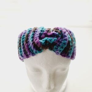 Chunky ribbed crochet ear warmer headband in a purple colourway shown on white mannequin head.