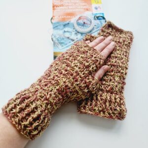 Red and Yellow British wool crochet fingerless mitts. Show on makers left hand resting on top of right mitts and OS map.