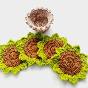 Crochet coasters set with two tone brown storage pot. Mats look like Succulent plants with brown middle and green leaves.