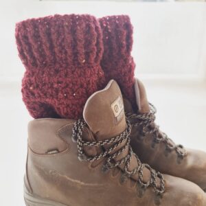 Crochet boot cuff ankle warmers, in a rich red colourway called Merlot. Shown in brown hiking boots.
