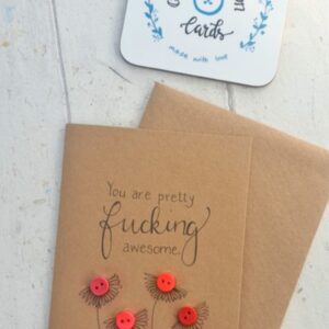 Button card on brown Kraft card with black handdrawn flowers and red buttons that says 'You are fucking awesome'